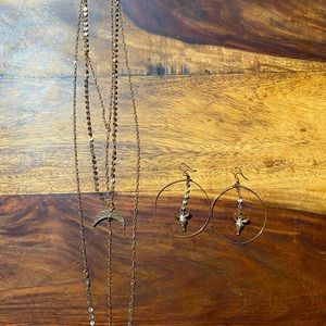 Gold statement necklace and cow skull earrings